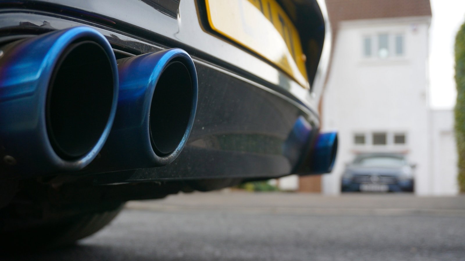 Close-up of blue exhaust pipes on a car.