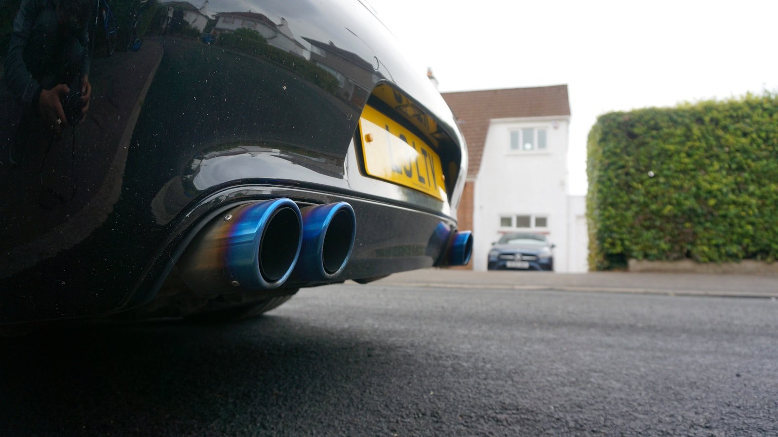 Close-up of blue exhaust pipes on a car.