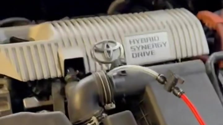 Engine carbon cleaning on a Toyota hybrid with the cleaning hose connected