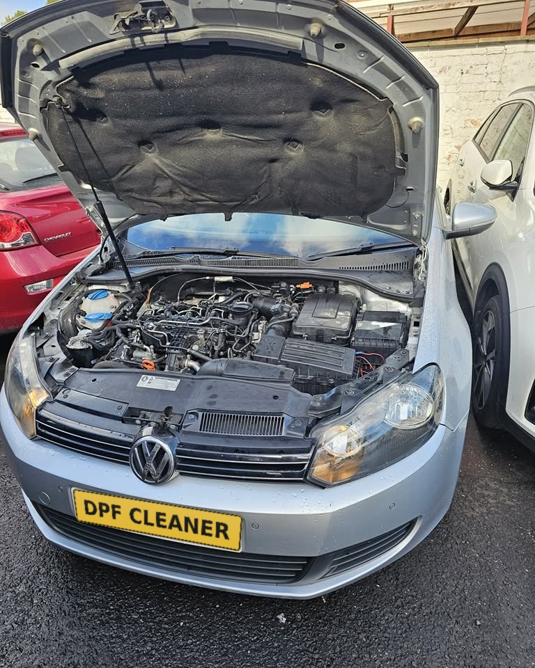 VW Golf diesel with the bonnet up for DPF work