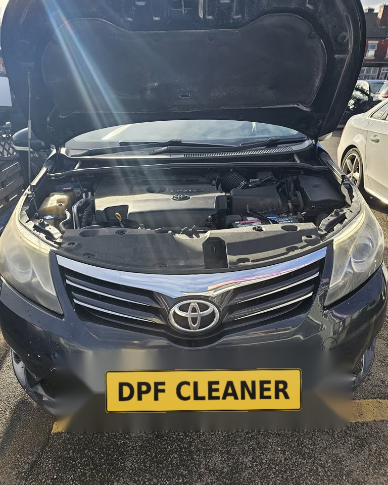 Toyota Avensis with its DPF fixed, bonnet up at the workshop