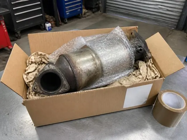 A removed DPF wrapped in bubble wrap and packed in a box ready to post for cleaning